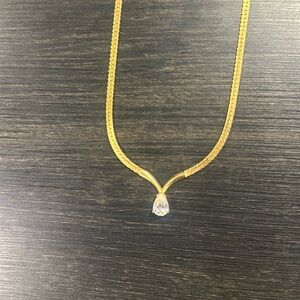 Gold herringbone V-neck with diamond pendant necklace